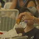 Illustration for article titled Tennis fan filmed dipping chicken fingers in Coke explains: “I just really liked the taste”em/em